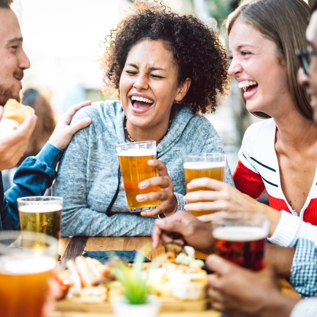 People laughing and drinking beer